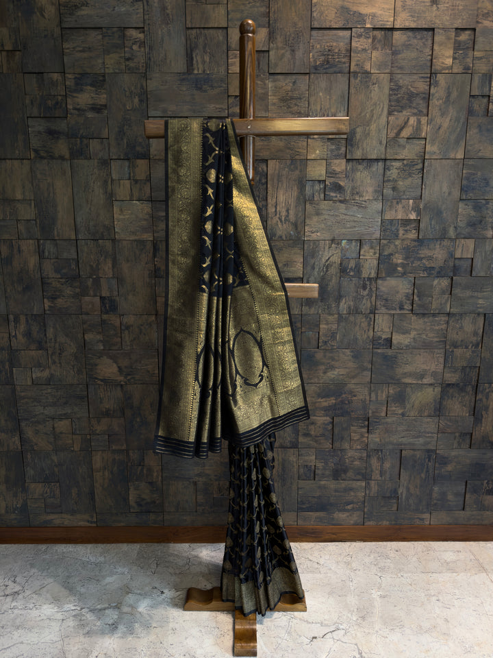 Black Banarasi satin silk saree with gold zari border and traditional woven motifs