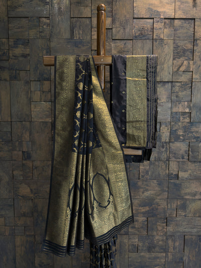 Traditional Banarasi satin silk saree in black shade with woven gold zari accents