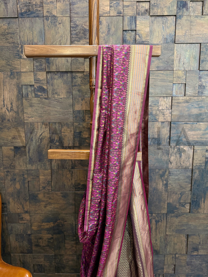Tanchoi weave close-up on black satin saree featuring gold zari border and detailed contrast pallu, ideal for festive or wedding wear