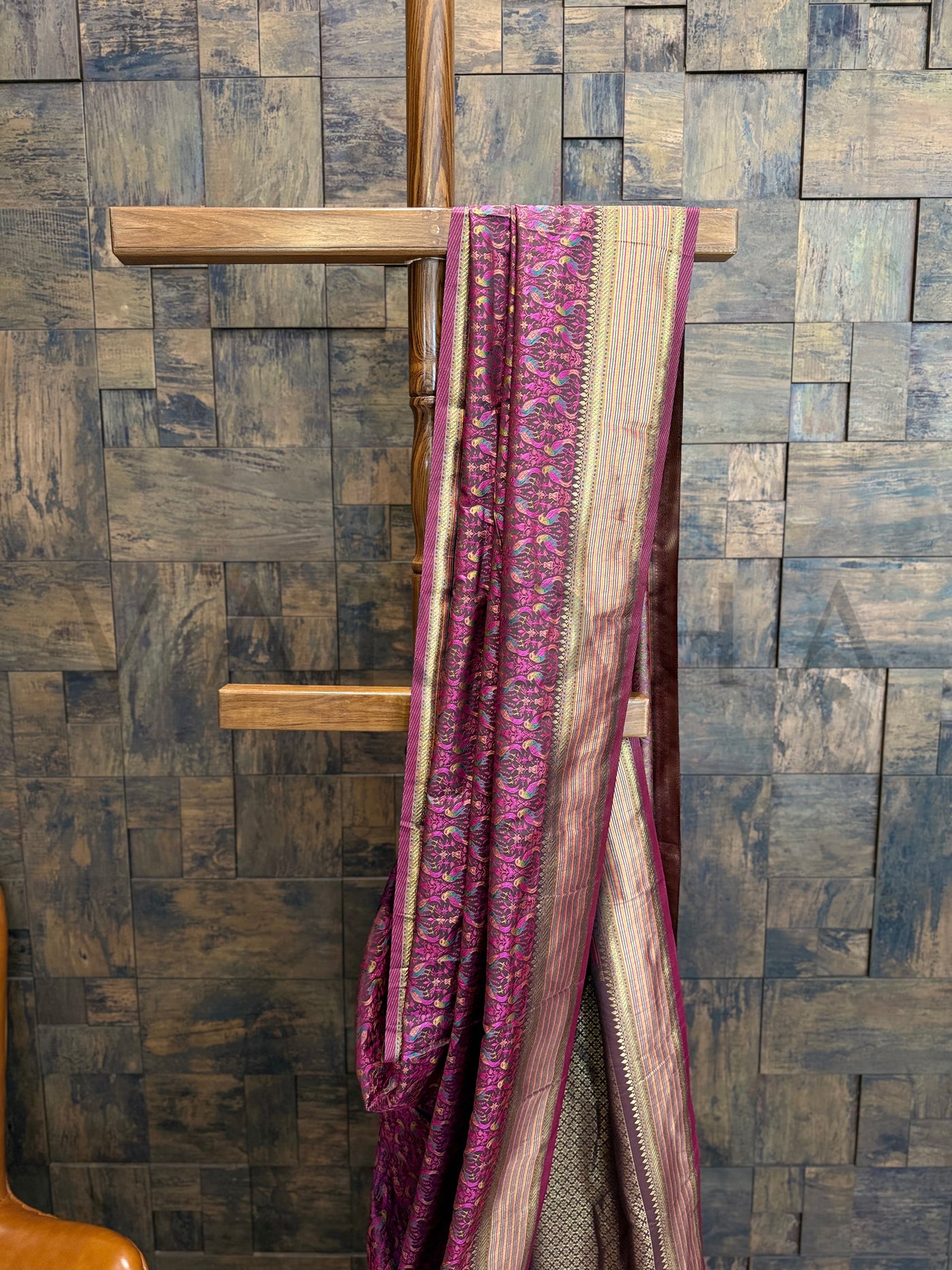 Tanchoi weave close-up on black satin saree featuring gold zari border and detailed contrast pallu, ideal for festive or wedding wear