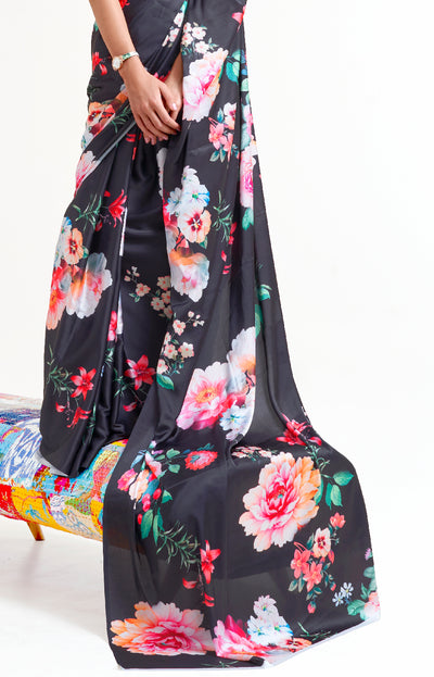 Designer black and white-pink crepe saree featuring digital floral prints and Bollywood-inspired drape, ideal for cultural celebrations.
