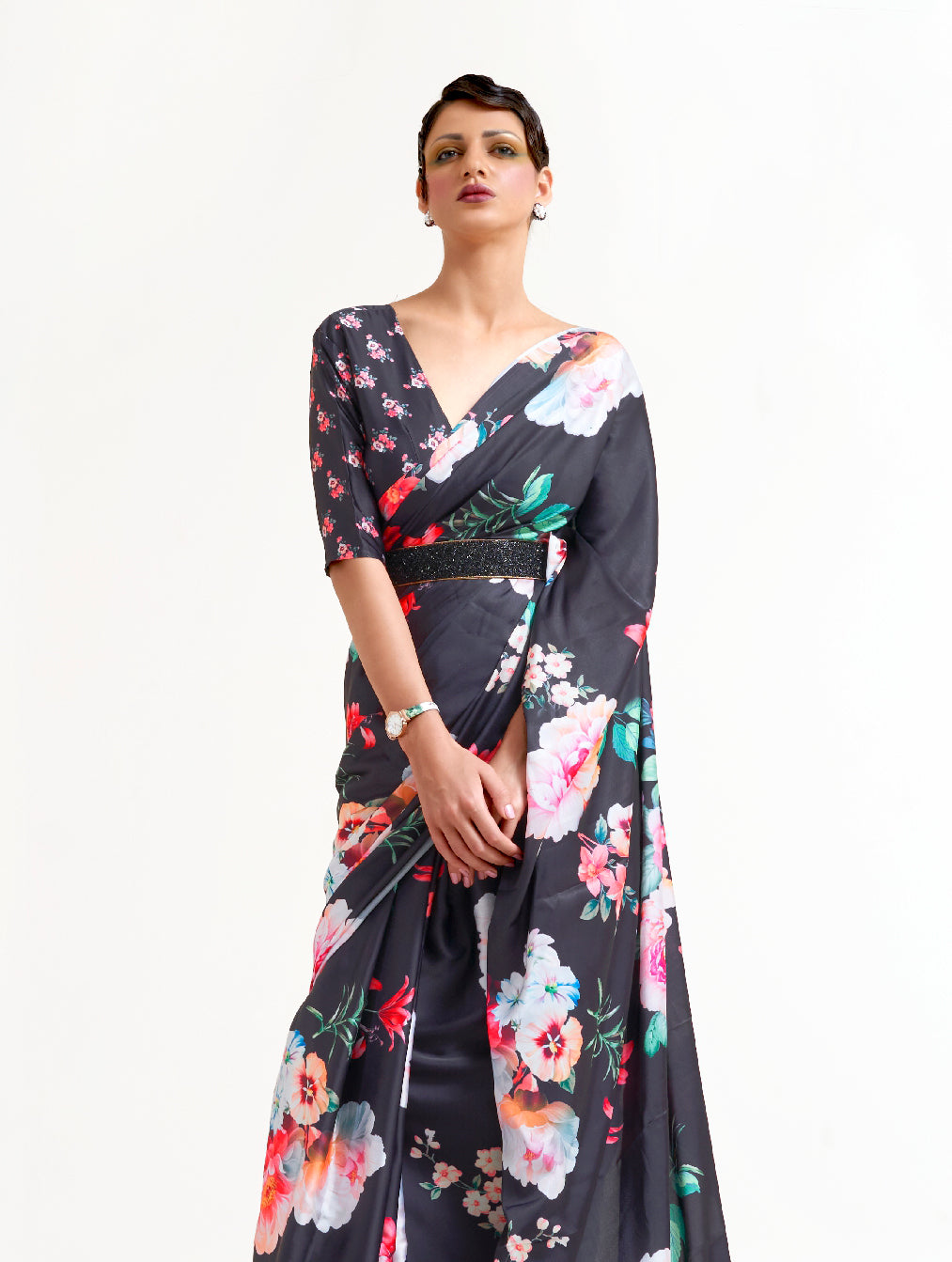 Elegant black, white, and pink soft crepe saree adorned with digital floral designs and Bollywood drape, suitable for special events.