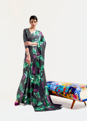 Black and pastel green-white digital printed soft crepe saree with Bollywood drape and floral patterns, perfect for festive occasions.
