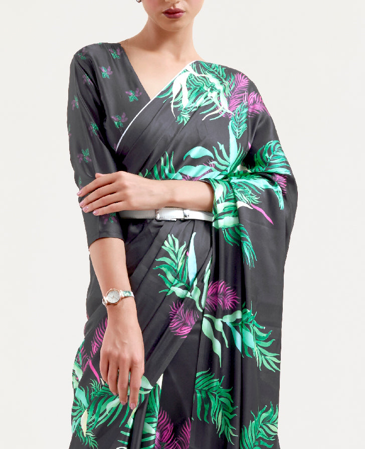 Designer black and pastel green-white crepe saree featuring digital floral prints and Bollywood-style drape, ideal for celebrations.