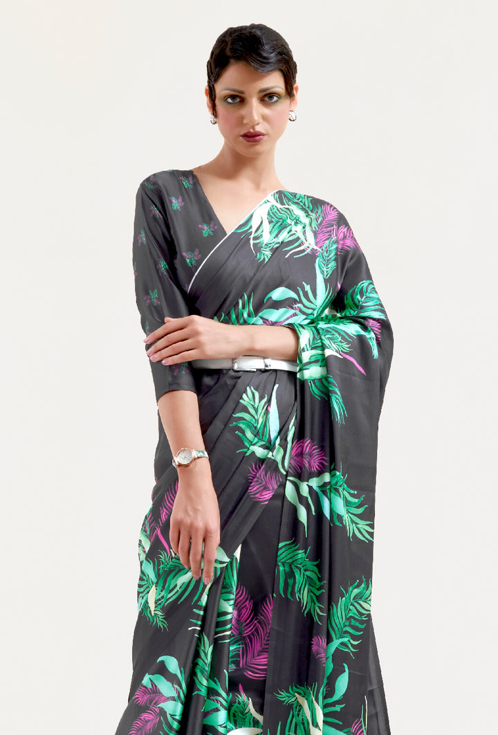 Elegant black and pastel green-white soft crepe saree adorned with digital floral patterns and Bollywood drape, suitable for special events.