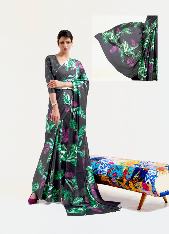 Stylish black and pastel green-white crepe saree showcasing digital floral prints and Bollywood drape, perfect for cultural celebrations.