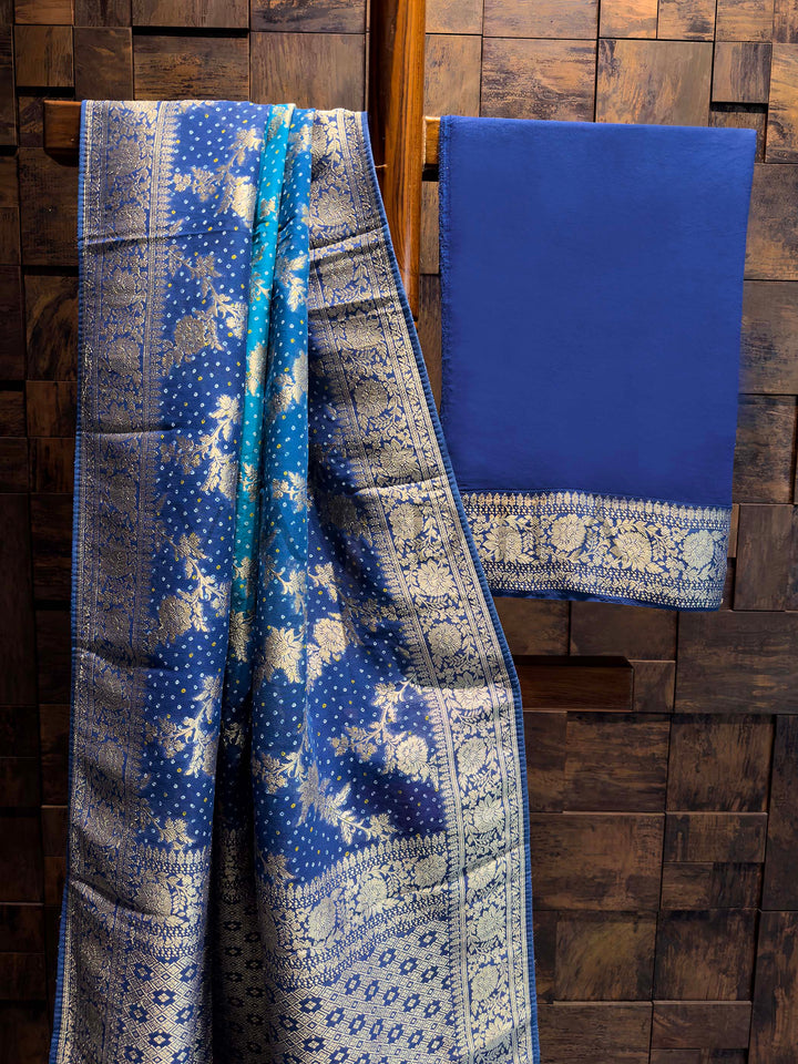 Two blue patterned fabrics on a wooden background
