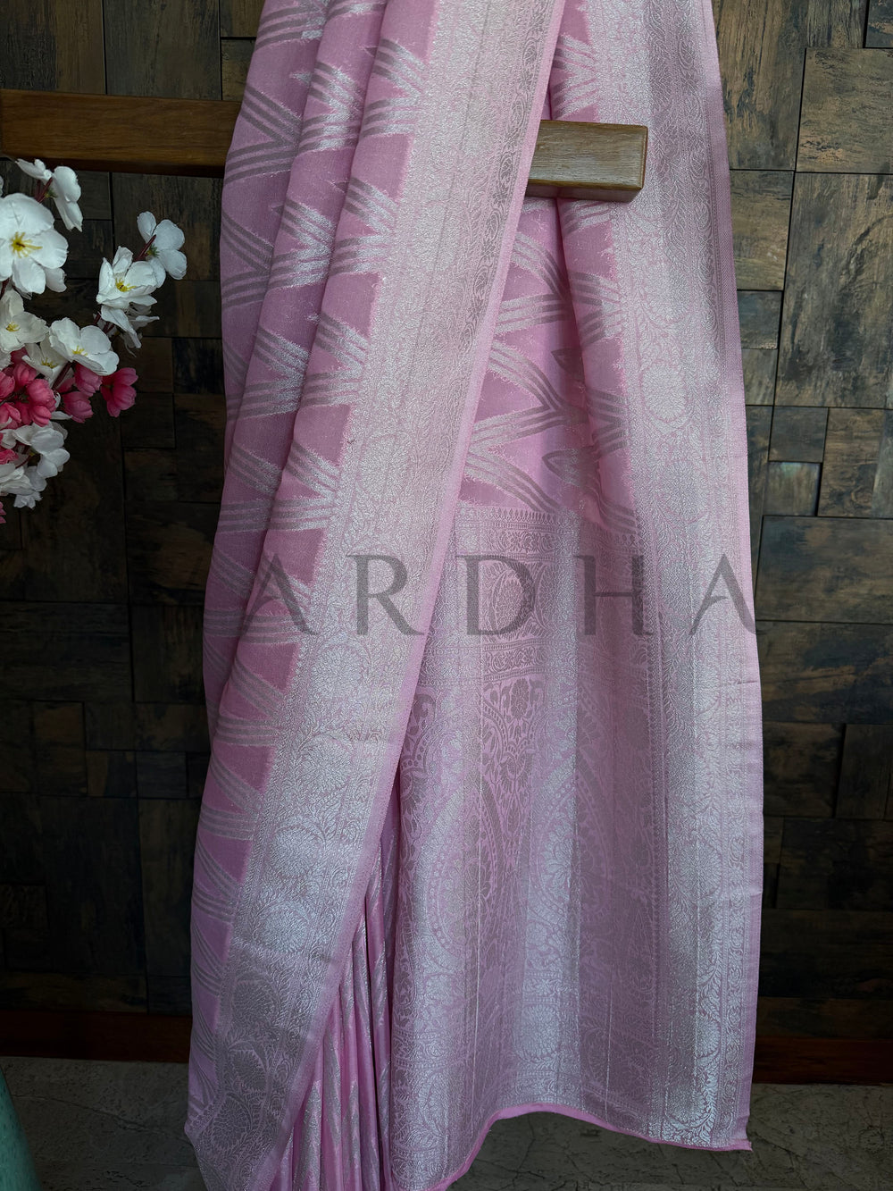 Soft pink saree with shimmer detail perfect for light events