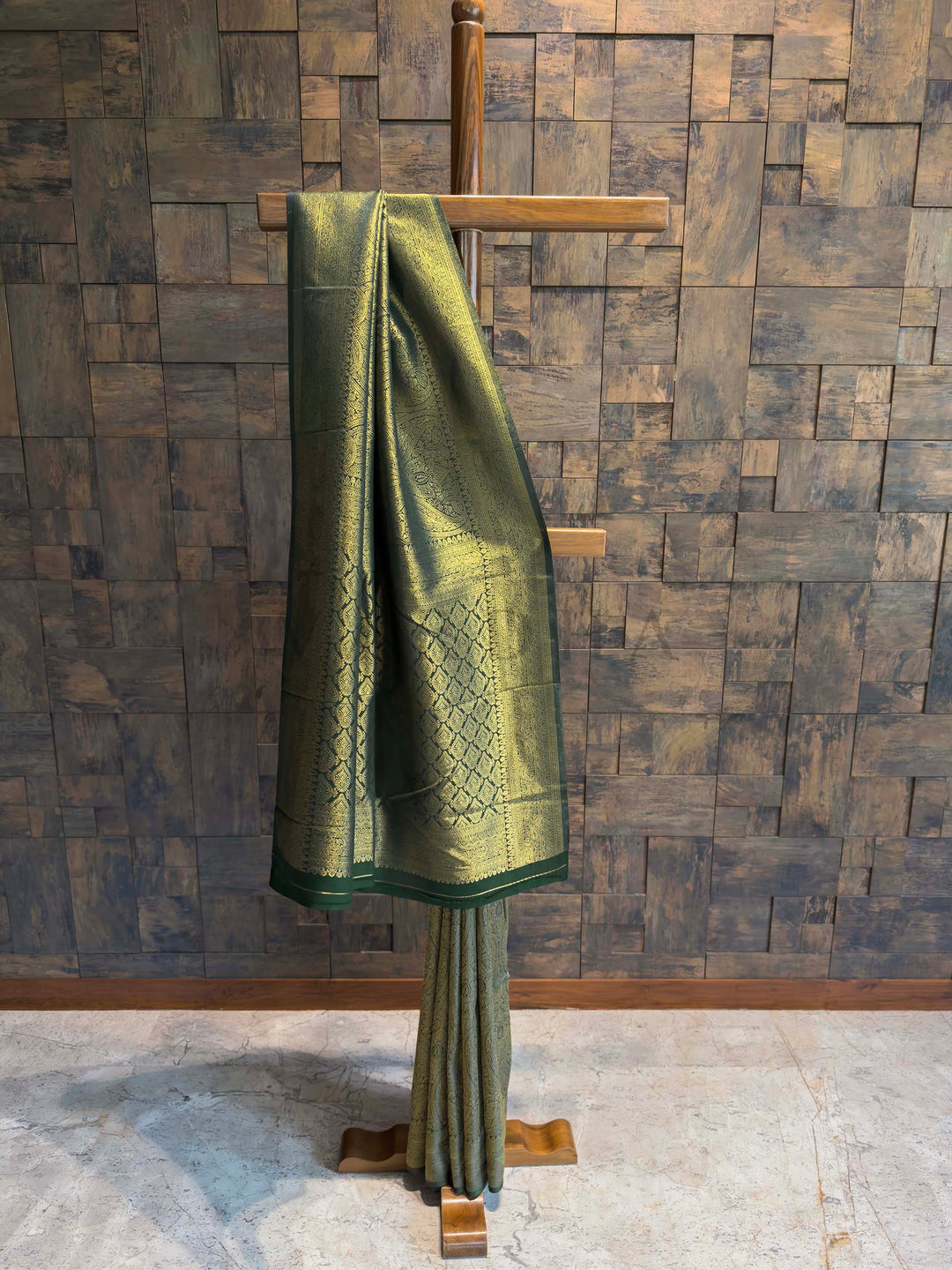 House of Vardha designer green silk saree with traditional gold Kanjivaram weaving, ideal for bridal and festive Indian wear. Bottle Green Golden Zari Kanjivaram Silk Saree House of Vardha