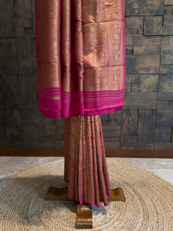Pink saree with a textured background Traditional Mysore Silk Saree with intricate golden border detailing