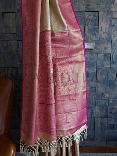Tassel detailing on the saree edge with luxurious texture of the art silk fabric