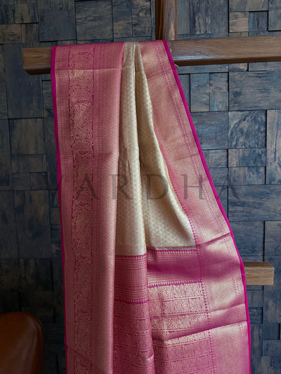 Elegant front view of saree with champagne gold and magenta contrast for festive wear