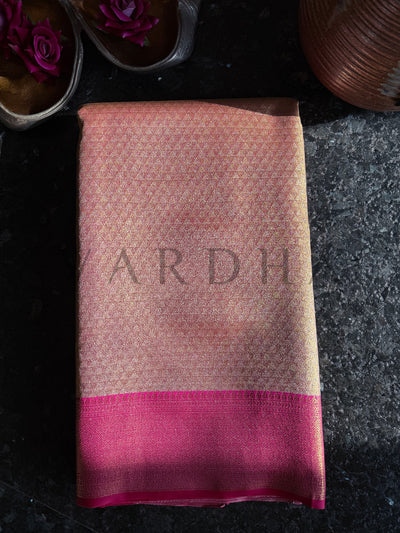 Folded view highlighting diamond weave pattern on beige body with magenta zari border


