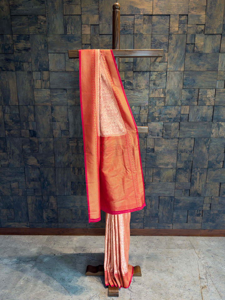 Full drape view of Cream and red Tanchoi Satin Silk saree on mannequin.
