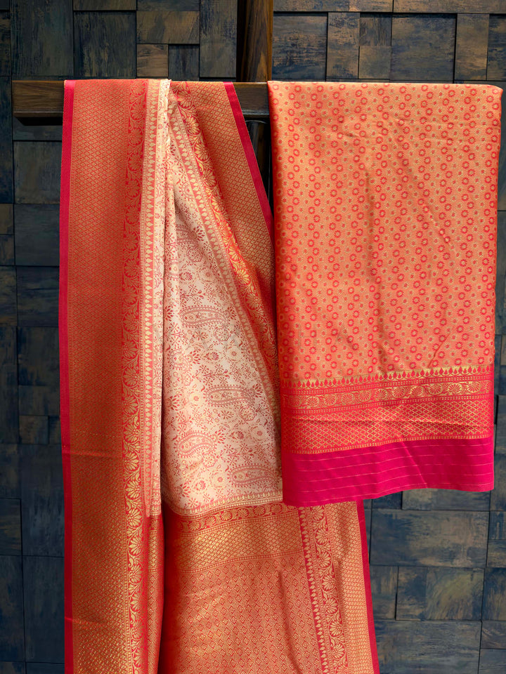 Saree with matching deep red blouse piece featuring all-over zari paisley buttis.
