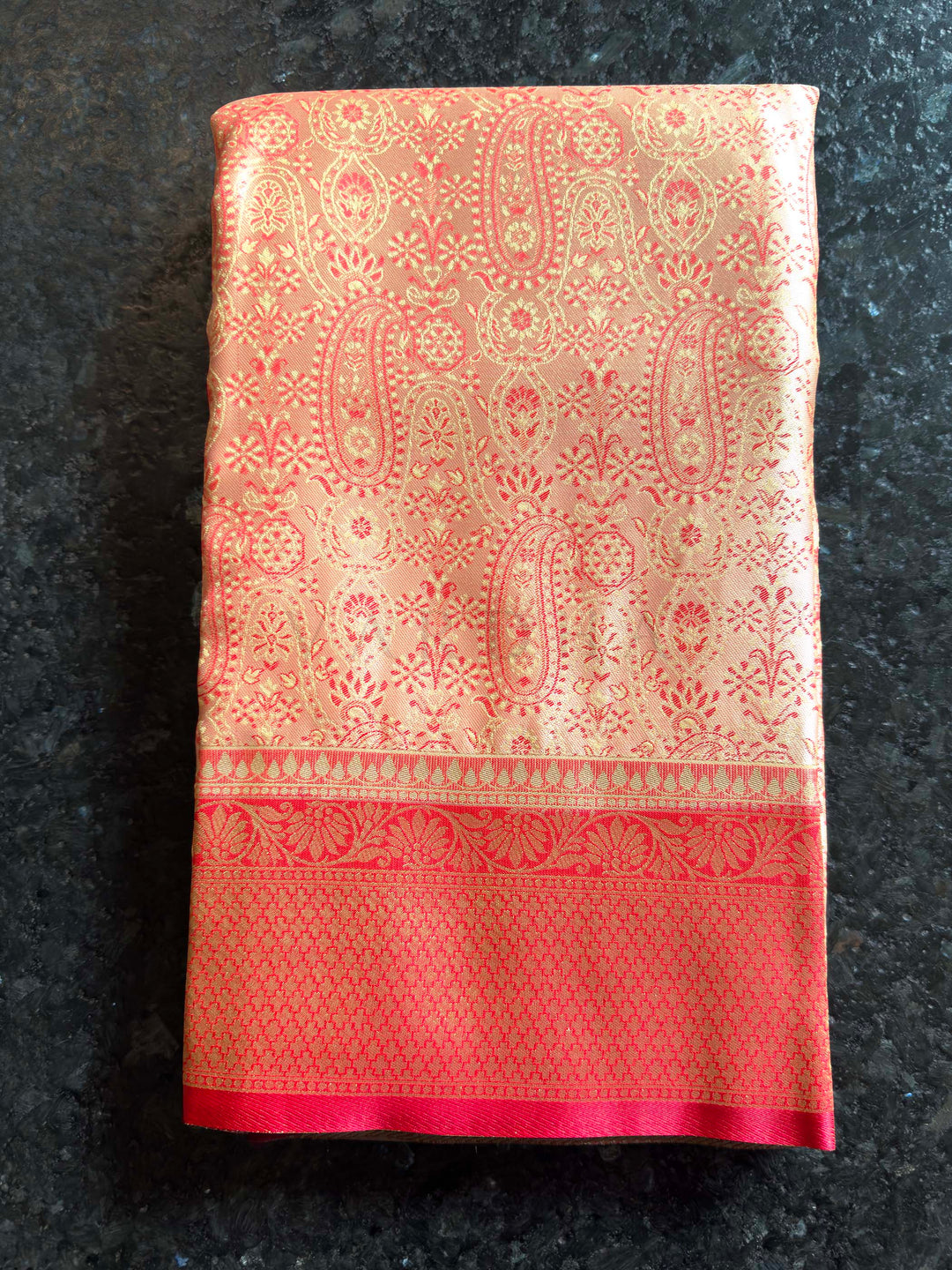 Folded view highlighting the sheen and intricate Tanchoi weave of the satin fabric.
