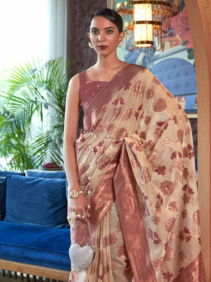 Designer Cream Organza Saree featuring Gottapatti Lace and Mirror Work Border, providing an Elegant Silhouette—perfect for Wedding Ceremonies and High-End Gatherings. 
