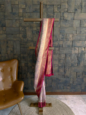 Cream pink kalamkari art silk saree with zari peacock motifs and rich pink border Traditional woven saree in cream with kalamkari work and ornate zari design
