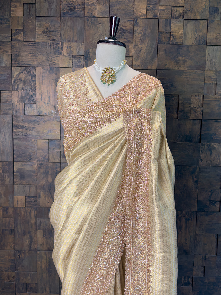 Designer Heavily Embroidered Pearl Blouse Piece paired with Warm Ivory Saree