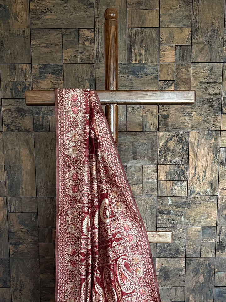 Traditional Maroon Lucknowi Chikankari Saree with Handcrafted Embroidery and an Entrancing Blouse, perfect for Special Occasions and Elegant Gatherings.


