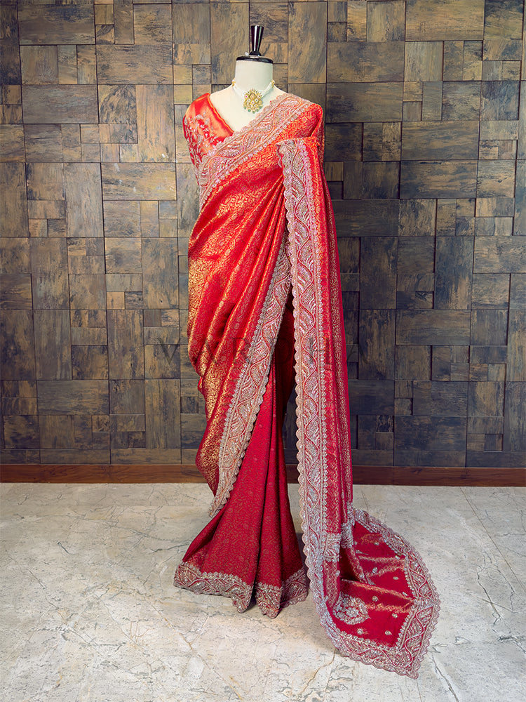 Red saree with gold patterns on a mannequin against a wooden paneled wall. Full View Bridal Red Kanjivaram Silk Saree with Stone Handwork