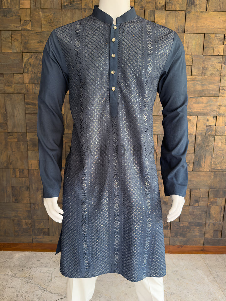Grey kurta on a mannequin against a wooden paneled wall. Full-length view of the charcoal grey men&