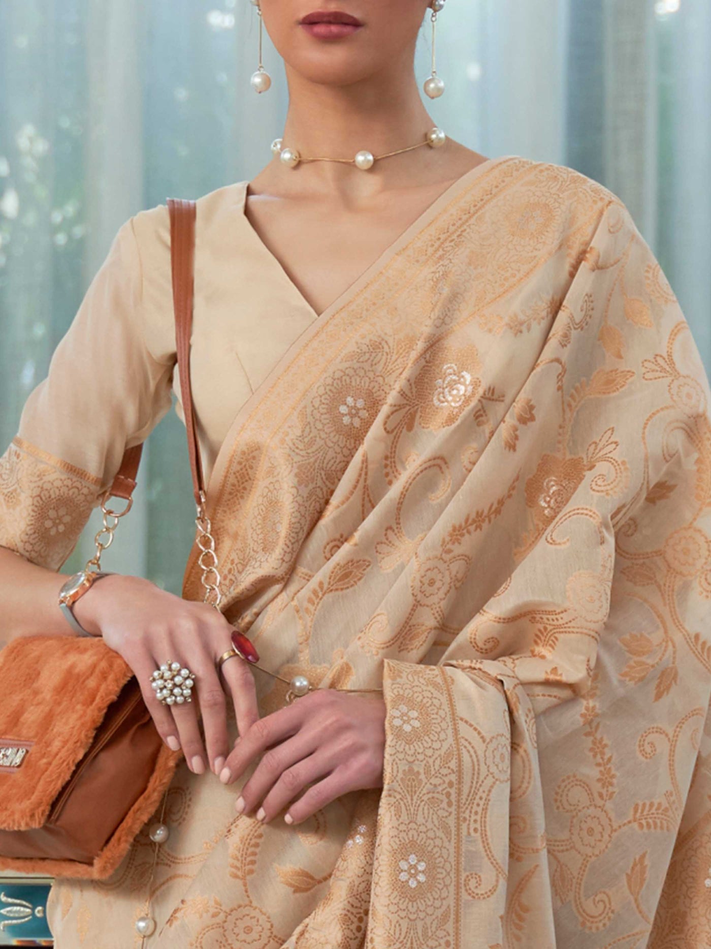 Elegant French Beige Chikankari Georgette Saree adorned with Intricate Lucknowi Weaving, perfect for Bridal Wear and Cultural Celebrations.


