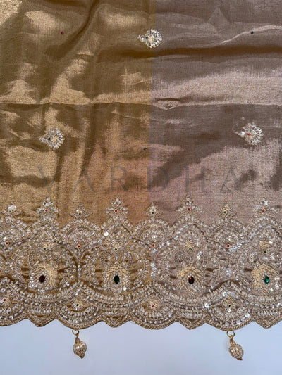 Close-up of floral embroidery and zari detailing with motifs on Off White Kanjivaram Saree.
