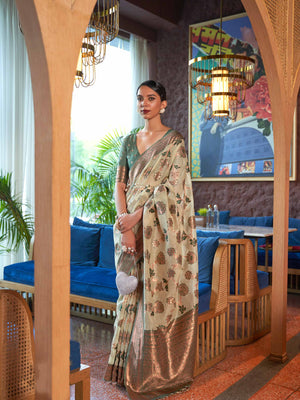 Green Shimmer Organza Saree with Copper Zari Weaving and Contrast Border, featuring an Exquisite Floral Jangla Design—a perfect blend of Traditional Craftsmanship and Modern Elegance for Festive Occasions. 
