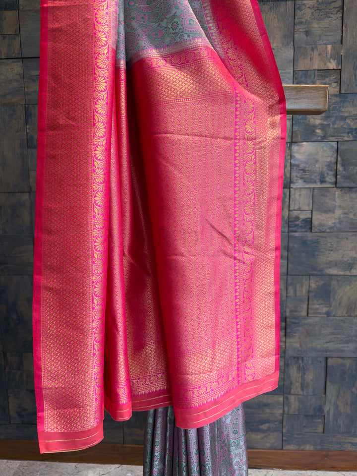 Detail shot of the Hot Pink Gold Zari border contrasting with the grey body.
