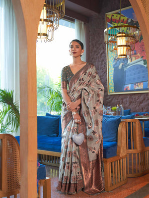 Grey Shimmer Organza Saree with Copper Zari Weaving and Contrast Border, featuring Exquisite Floral Jangla Design—a perfect blend of Traditional Craftsmanship and Modern Elegance for Festive Occasions. 
