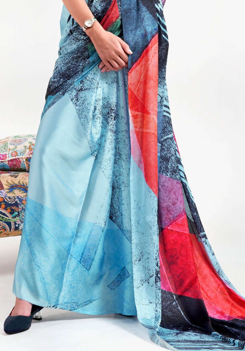Designer ice blue and ebony red crepe saree featuring digital floral prints and Bollywood-style drape, ideal for celebrations
