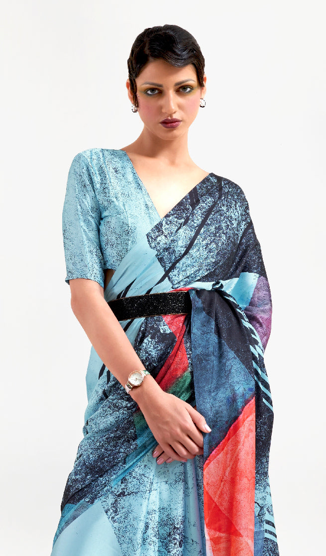 Elegant ice blue and ebony red soft crepe saree adorned with digital floral patterns and Bollywood drape, suitable for special events.
