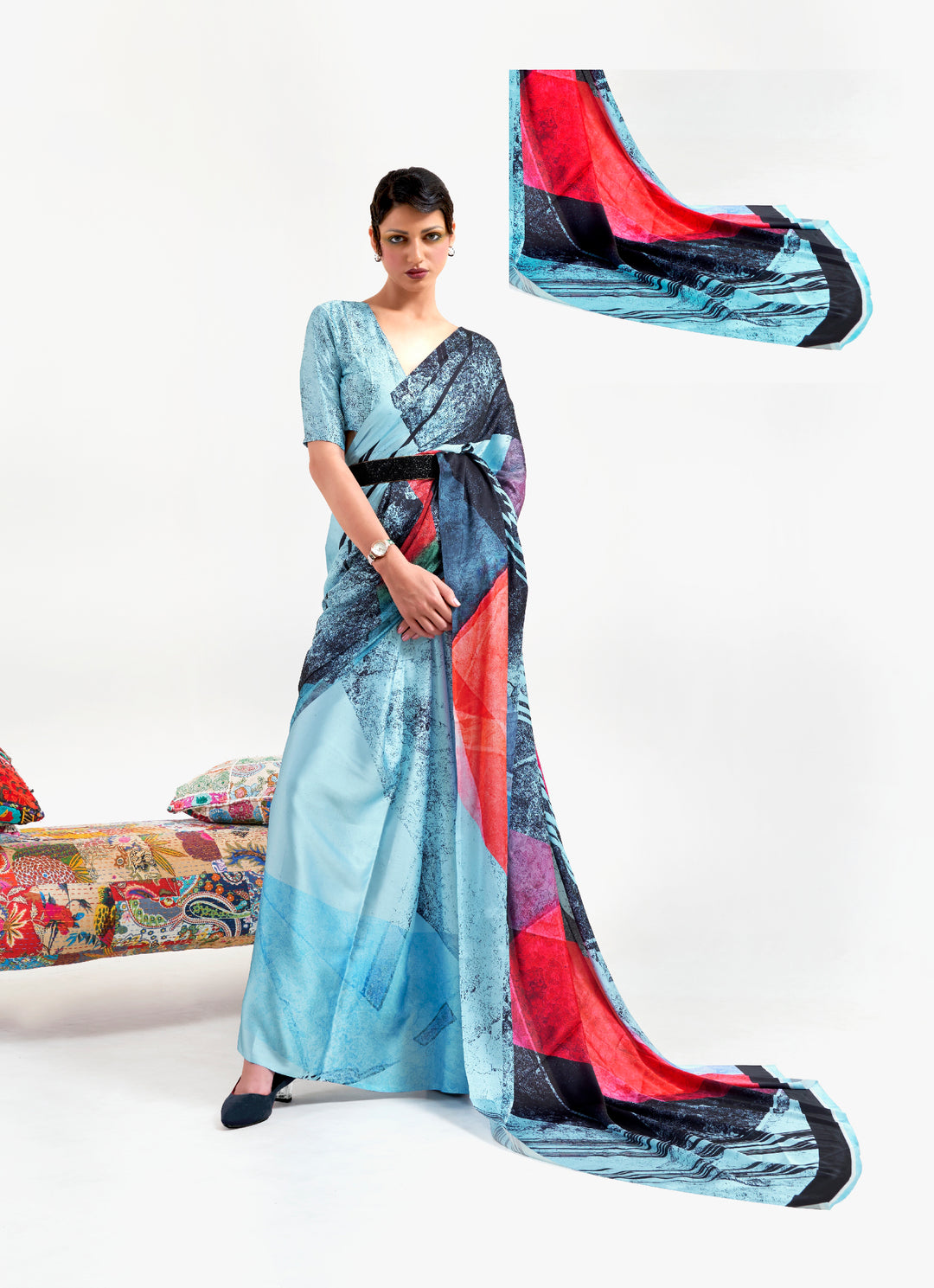 Stylish ice blue and ebony red crepe saree showcasing digital floral prints and Bollywood drape, perfect for cultural celebrations.