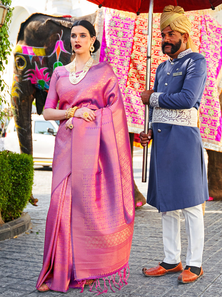 Rani Pink–Purple bridal kanjivaram saree with gold zari motifs and festive pallu styling. Classic Rani Pink–Purple silk saree featuring woven jacquard zari and traditional pallu elegance.