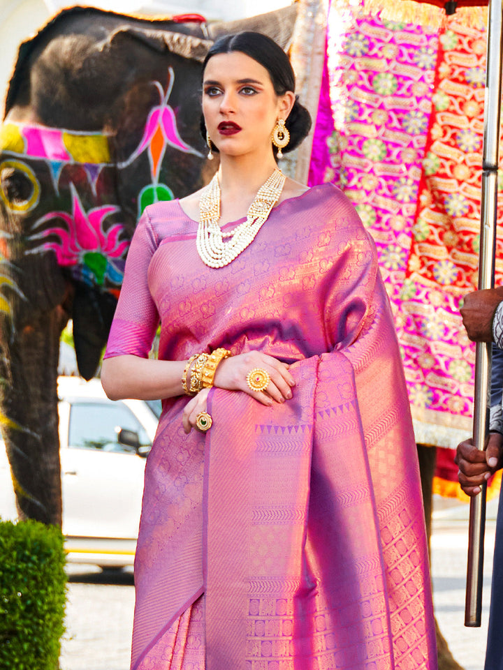 Rani Pink–Purple kanjivaram silk drape styled for receptions, varmala, and wedding rituals. Glossy silk base in Rani Pink–Purple with gold accents and woven border flair.