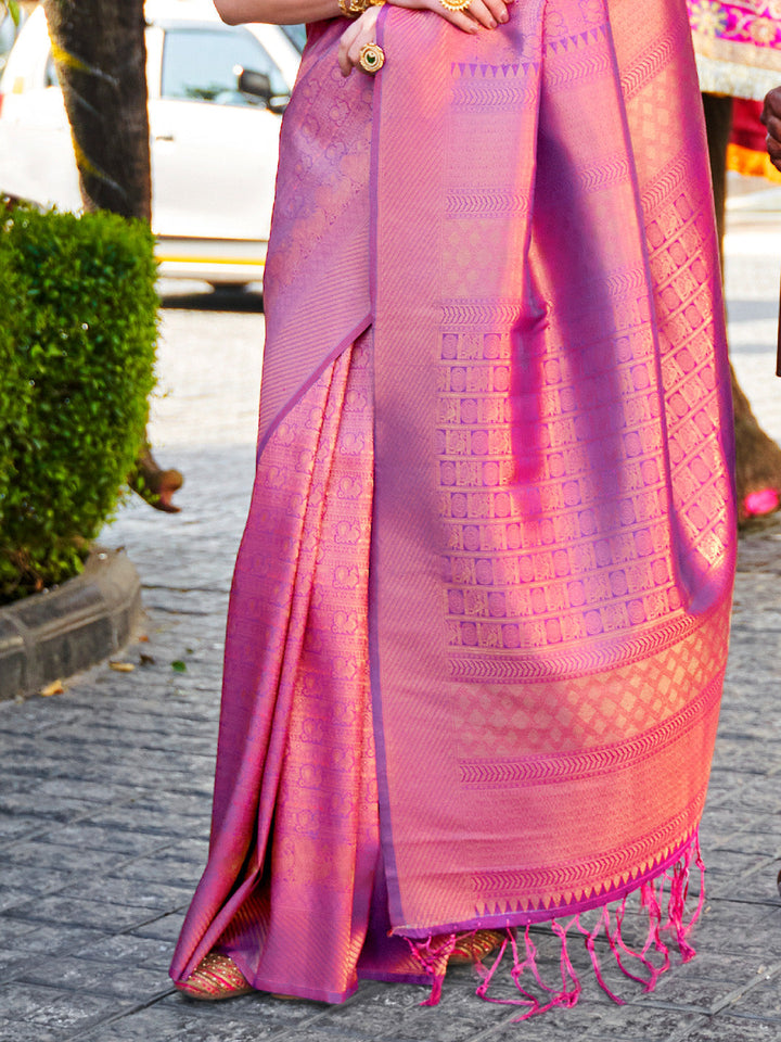 Opulent kanjivaram weave in Rani Pink–Purple silk, styled with contrast blouse and pallu. South Indian inspired bridal saree in Rani Pink–Purple with glossy texture and rich borders.