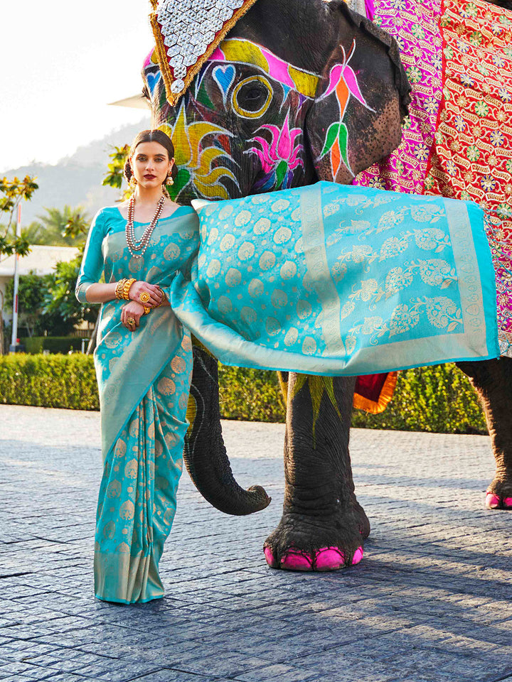 Opulent kanjivaram weave in Teal Blue–Green silk, styled with contrast blouse and pallu. South Indian inspired bridal saree in Teal Blue–Green with glossy texture and rich borders.