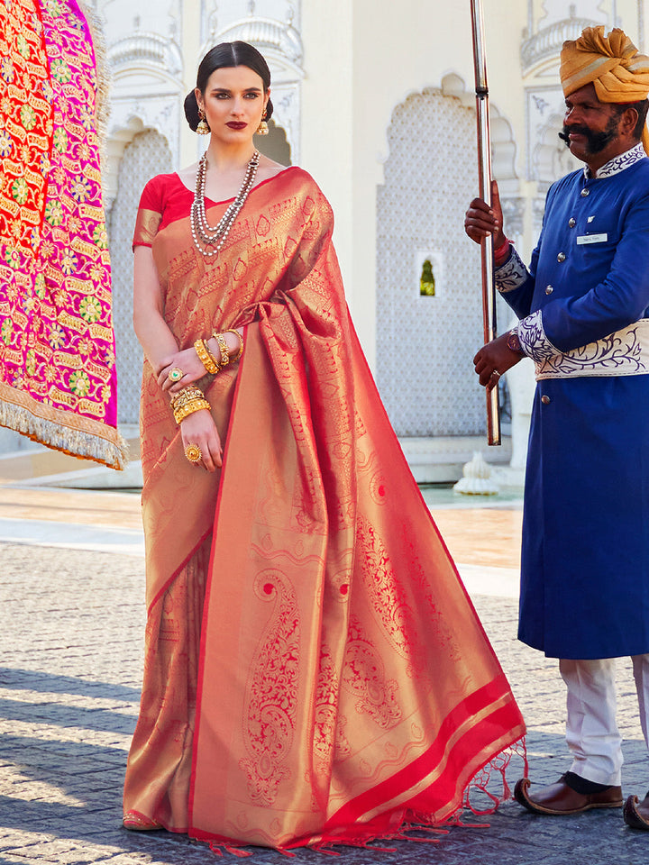 Maroon–Gold bridal kanjivaram saree with gold zari motifs and festive pallu styling. Classic Maroon–Gold silk saree featuring woven jacquard zari and traditional pallu elegance.