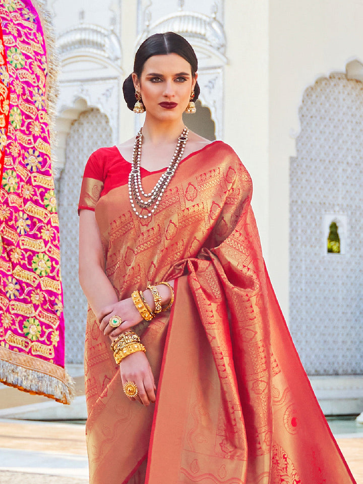 Maroon–Gold kanjivaram silk drape styled for receptions, varmala, and wedding rituals. Glossy silk base in Maroon–Gold with gold accents and woven border flair.