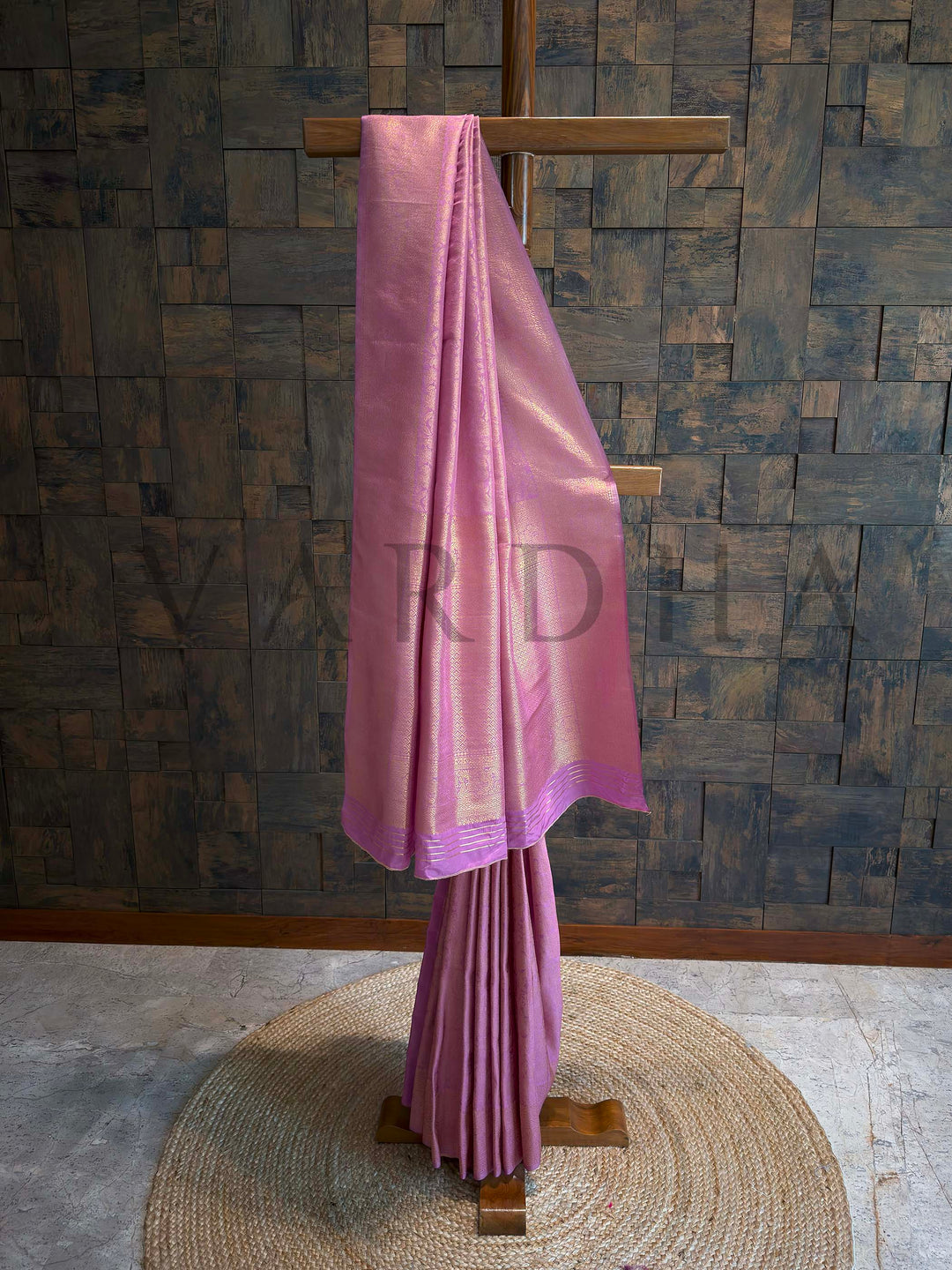 Orchid lavender Kanjivaram art silk saree folded with golden zari floral jaal and geometric brocade border, pastel sheen and traditional craftsmanship visible. Beautifully draped Lilac Kanjivaram Silk Saree showcasing the soft fall of the fabric and the glimmer of the Gold Zari Weave patterns by House of Vardha. We offer Ready to wear, Pre drape service, Saree Add on, Custom Stitched Blouse, Fall and Edging, Gift Packaging at Complimentary Price!