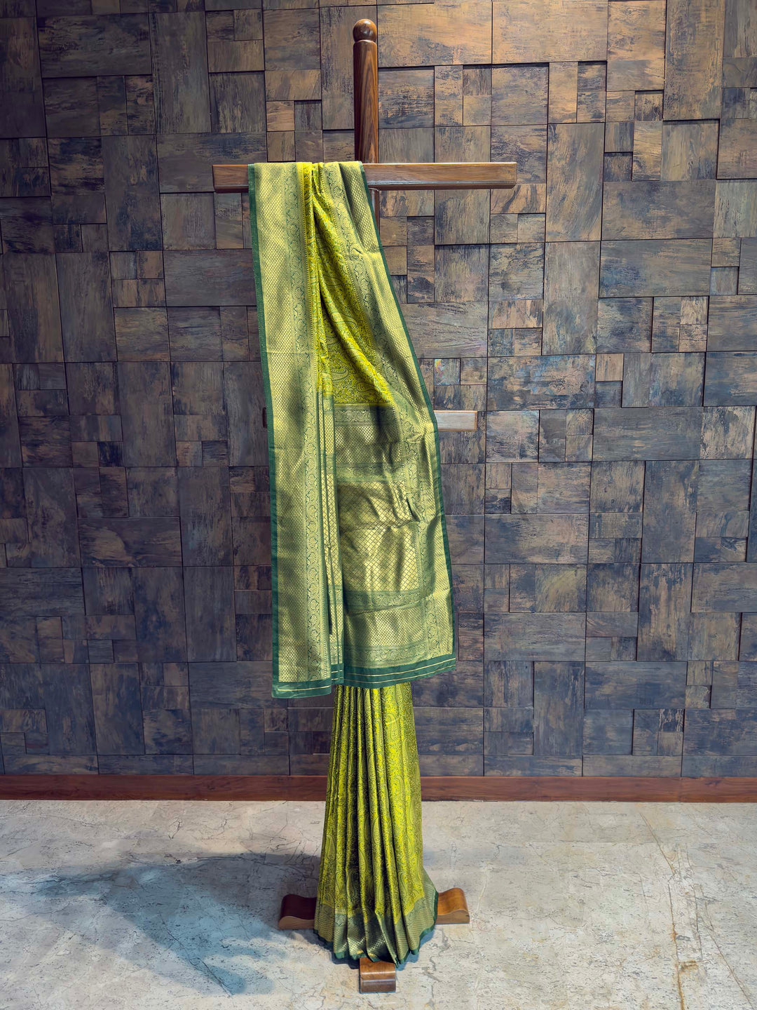 Full drape view of Lime Green Tanchoi Satin Silk saree with Dark Green border on mannequin.