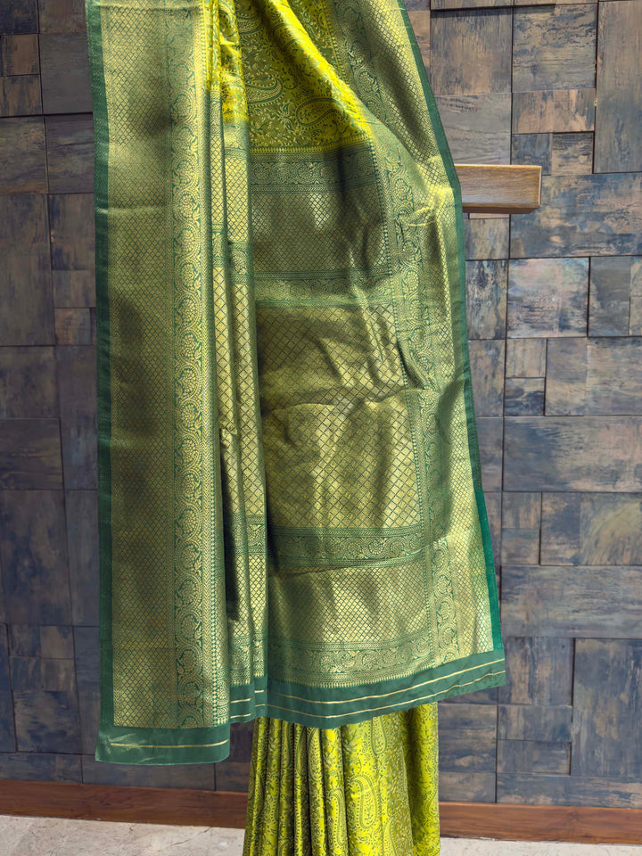 Detail shot of the Bottle Green Gold Zari border contrasting with the lime body.