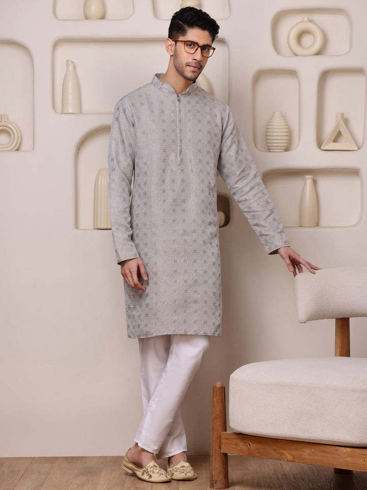 Close-up of the detailed gold jacquard pattern and the elegant concealed zipper on the placket of the grey kurta