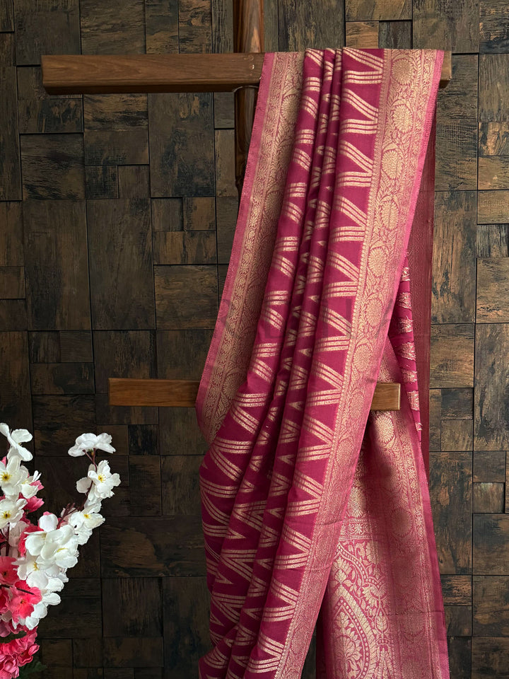 Lightweight georgette saree with rose pink base and ethnic motifs – perfect festive drape.

