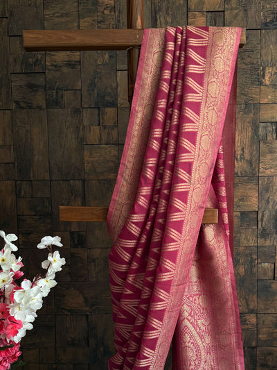 Lightweight georgette saree with rose pink base and ethnic motifs – perfect festive drape.

