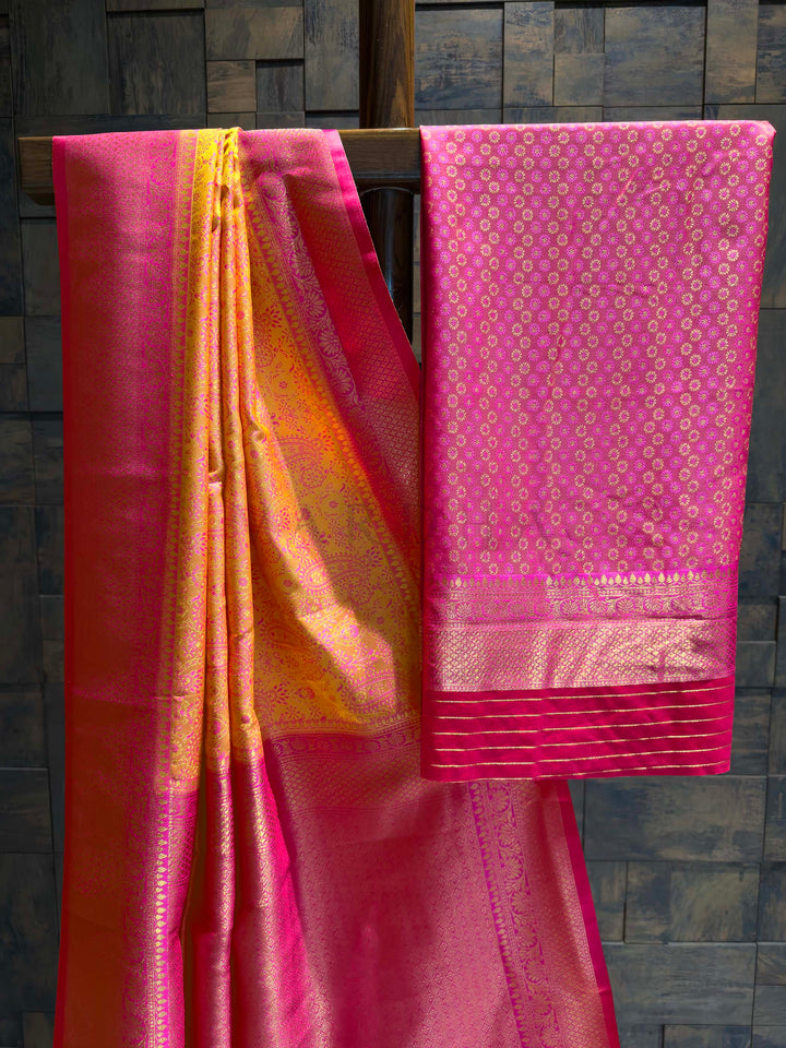 Saree with matching Hot Pink blouse piece featuring all-over zari floral buttis.