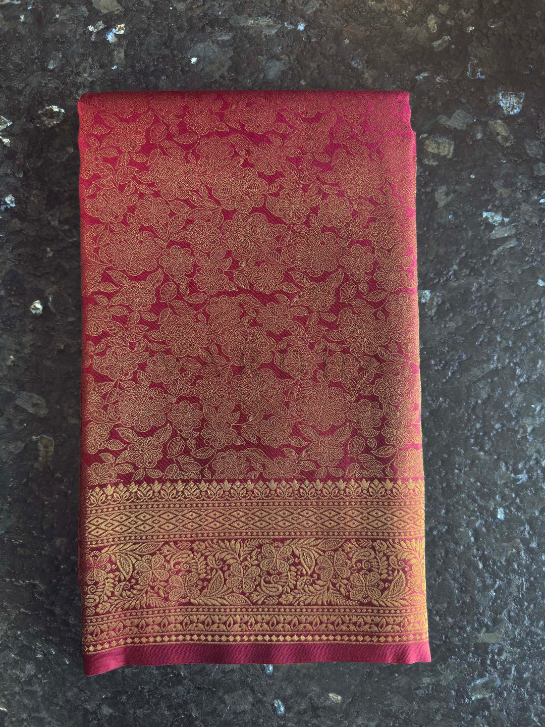 Maroon Golden Zari Kanjivaram Silk Saree House of Vardha. Authentic Indian ethnic wear featuring a radiant deep reddish-copper saree richly woven with golden threads by House of Vardha. We offer Ready to wear, Pre drape service, Saree Add on, Custom Stitched Blouse, Fall and Edging, Gift Packaging at Complimentary Price!