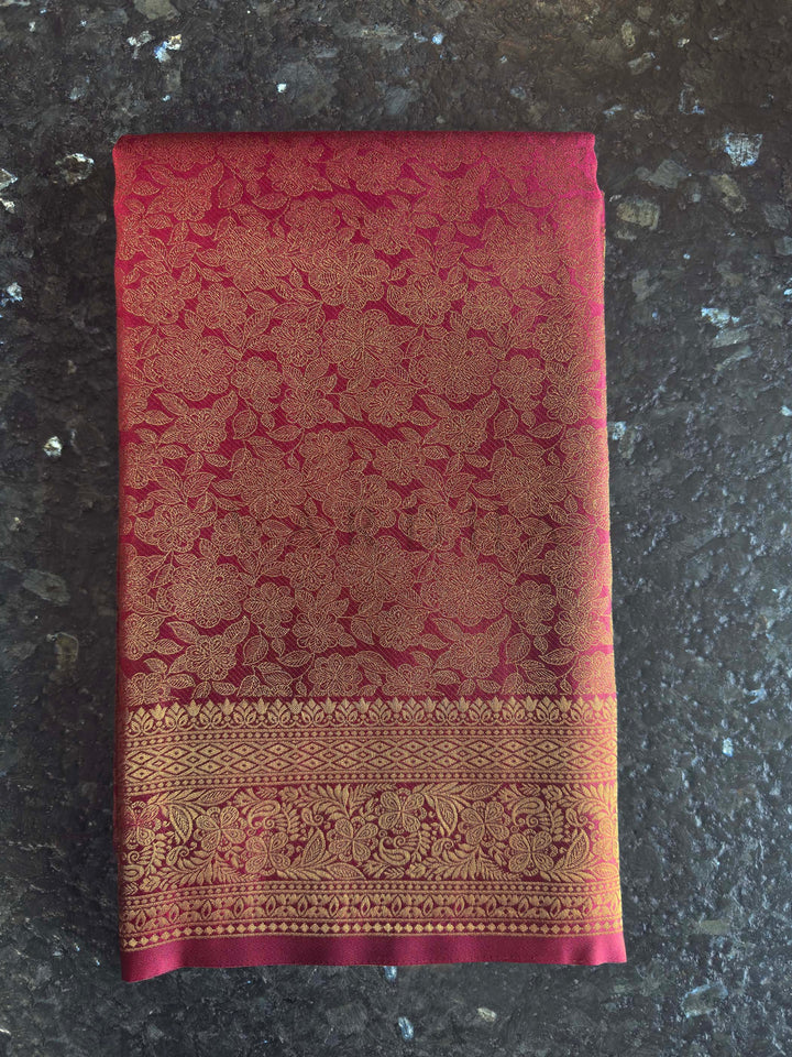 Maroon Golden Zari Kanjivaram Silk Saree House of Vardha. Authentic Indian ethnic wear featuring a radiant deep reddish-copper saree richly woven with golden threads by House of Vardha. We offer Ready to wear, Pre drape service, Saree Add on, Custom Stitched Blouse, Fall and Edging, Gift Packaging at Complimentary Price!
