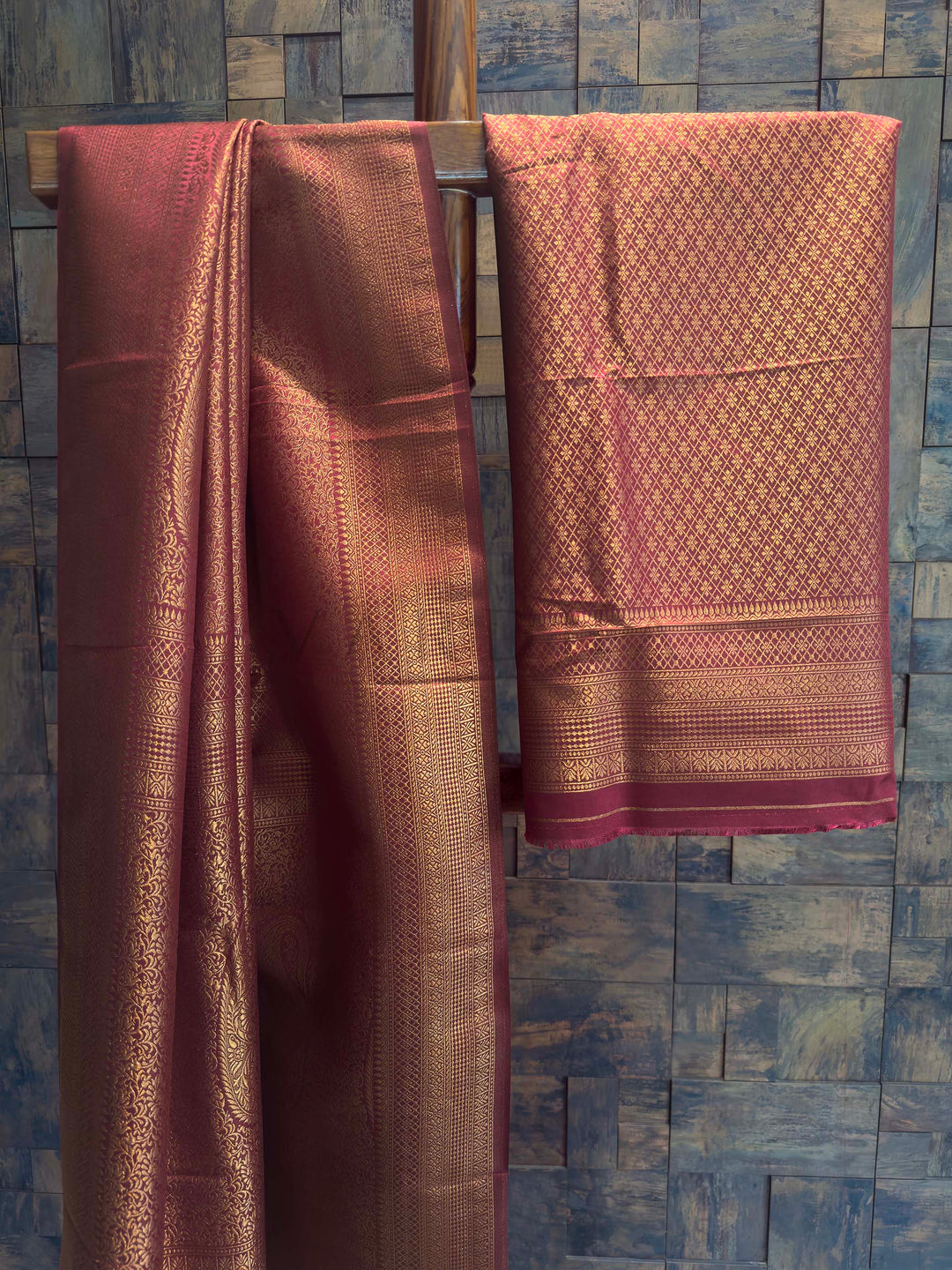 Maroon Golden Zari Kanjivaram Silk Saree House of Vardha. Authentic Indian ethnic wear featuring a striking Maroon Golden Zari Kanjivaram Silk Saree richly woven with golden threads to create a luxurious look by House of Vardha. We offer Ready to wear, Pre drape service, Saree Add on, Custom Stitched Blouse, Fall and Edging, Gift Packaging at Complimentary Price!